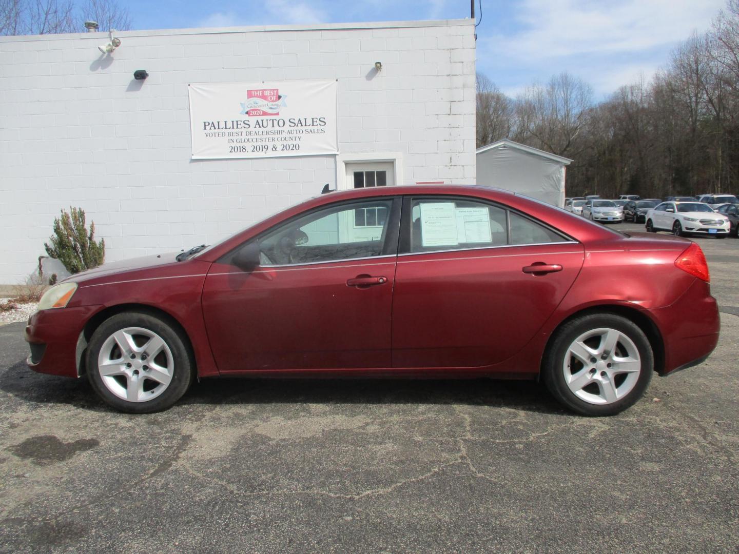 2009 RED Pontiac G6 Sedan (1G2ZJ57B994) with an 2.4L L4 DOHC 16V engine, 4-Speed Automatic transmission, located at 540a Delsea Drive, Sewell, NJ, 08080, (987) 867-5309, 39.752560, -75.111206 - Photo#1